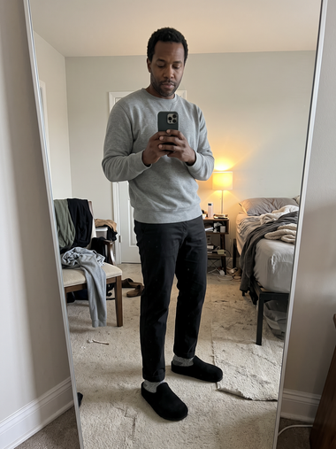 Black Suede Relief Clog in a bedroom mirror photo
