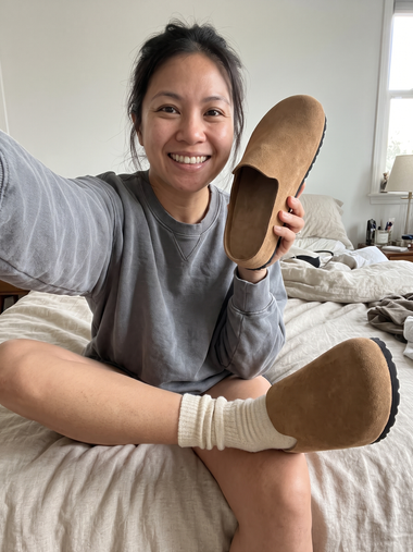 Holding up a Tan Suede Relief Clog